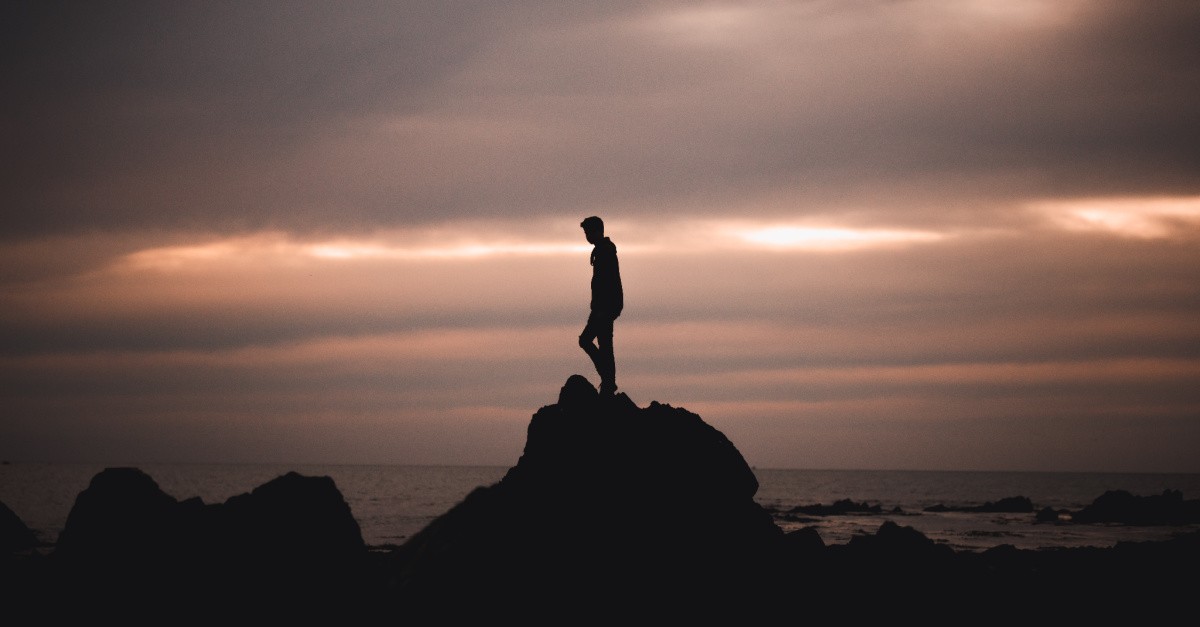 a man on a rock, You are a body... not in one