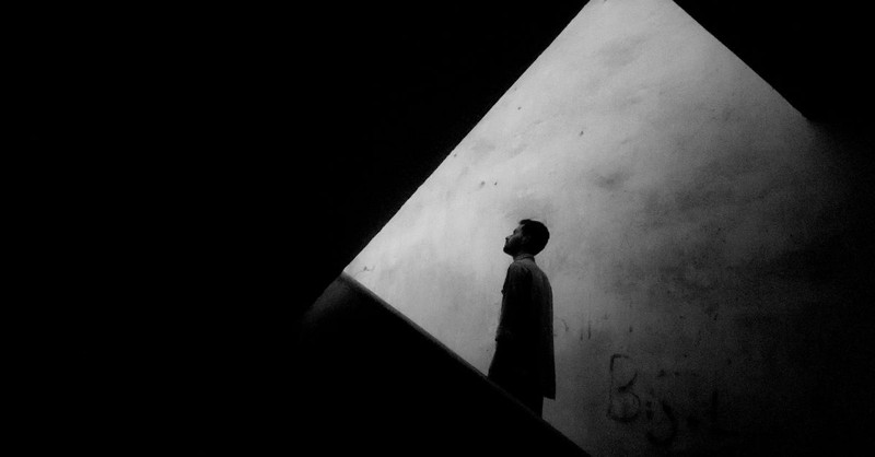 Black and White Photo of a Man Walking Up Stairs; how do we live out our purpose in difficult seasons of life?